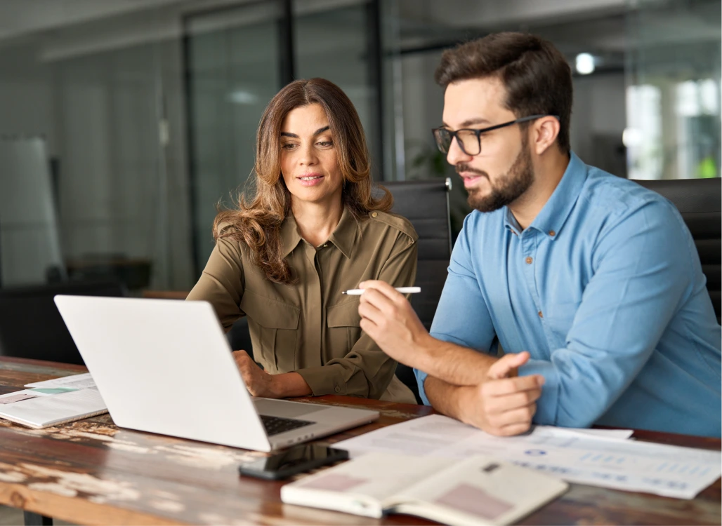 two persons are discussing on a project